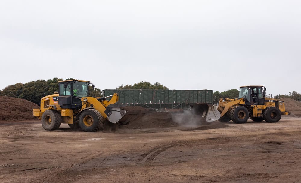 two tractors with mulch 1000×610